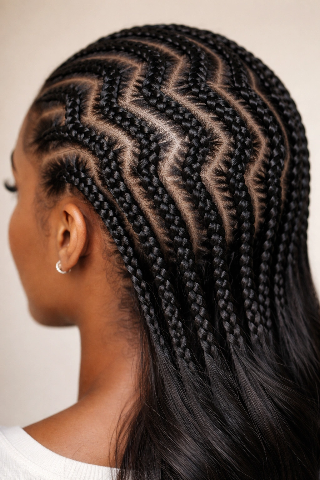 Close-up of sculptural zig-zag wave-pattern straight back cornrows