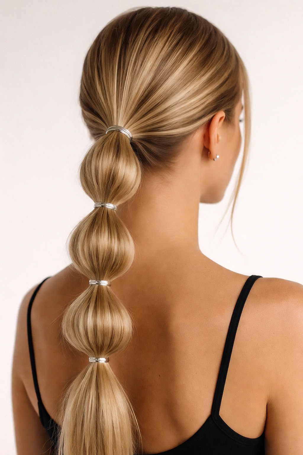 Bubble ponytail with evenly spaced bubble sections along the hair
