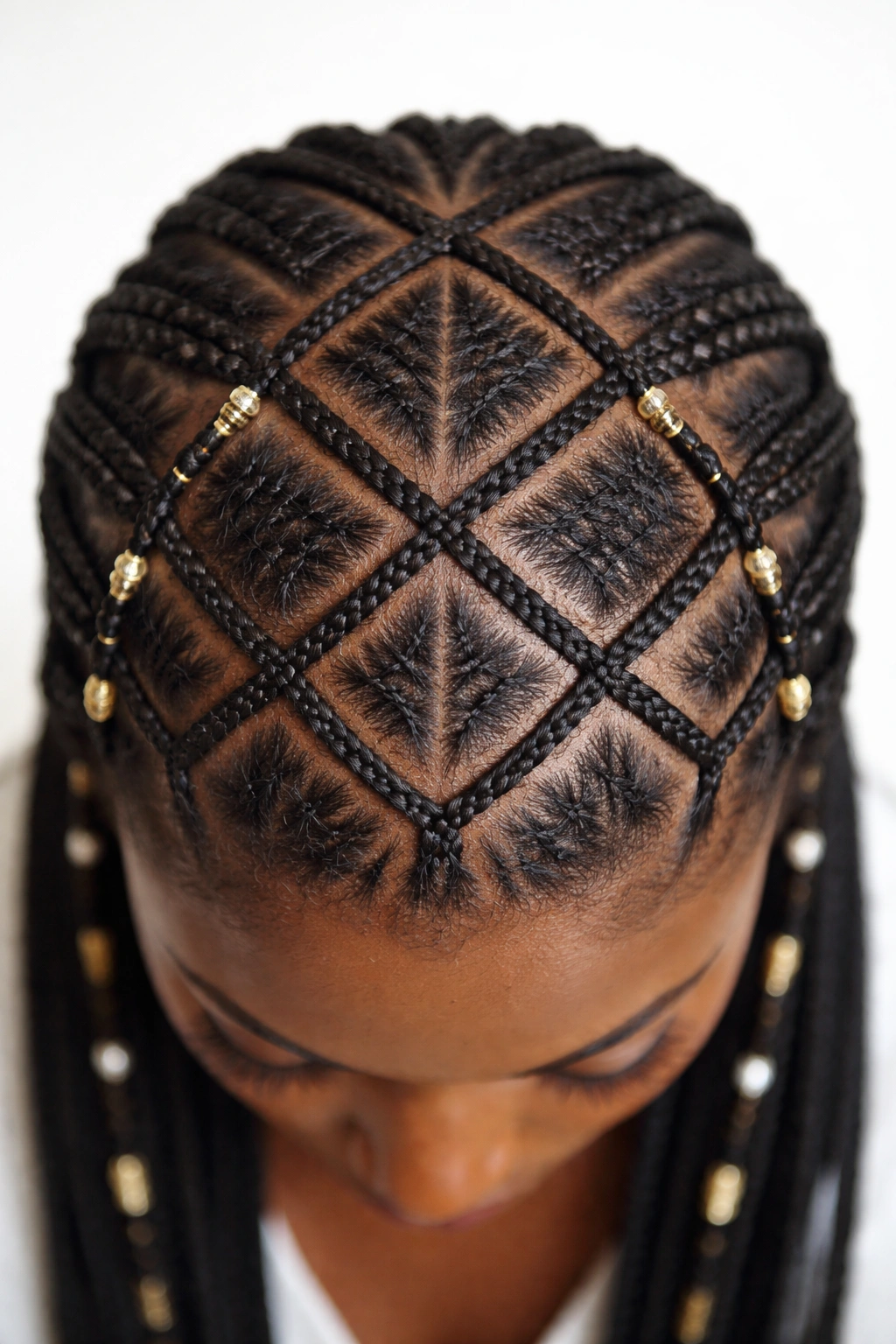 Top-down view of a scalp with intricate cane row patterns