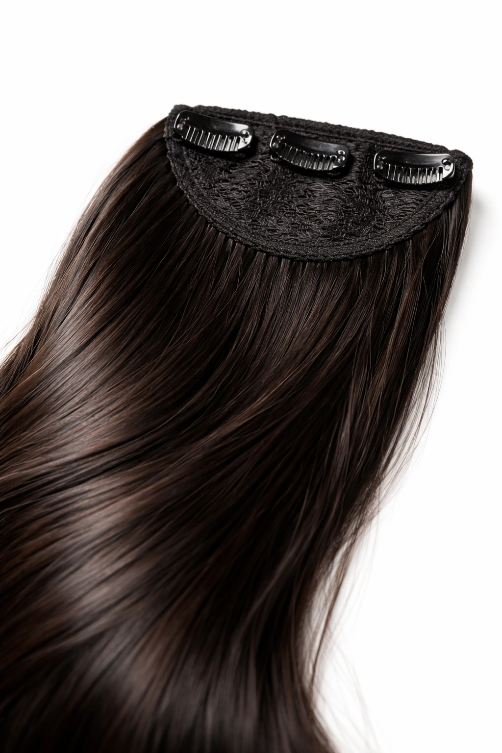 Close-up of clip-in ponytail extension with clips on a neutral backdrop