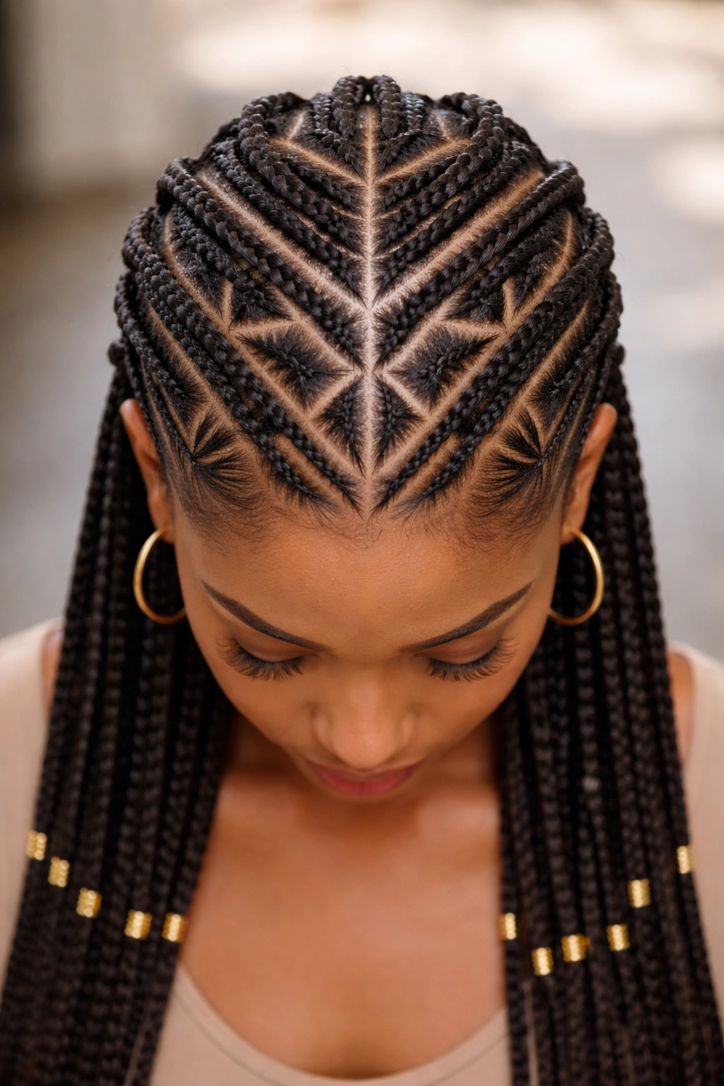 Top-down view of geometric pattern cornrows across scalp