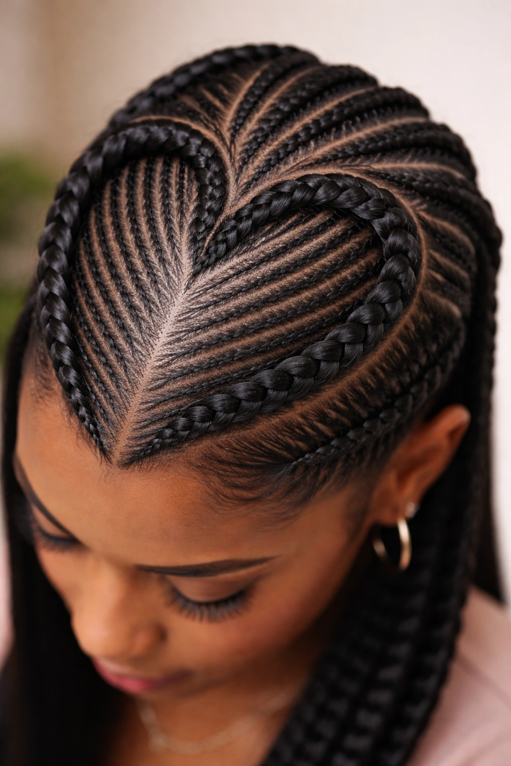 Heart outline formed by thick braid around fine cornrows