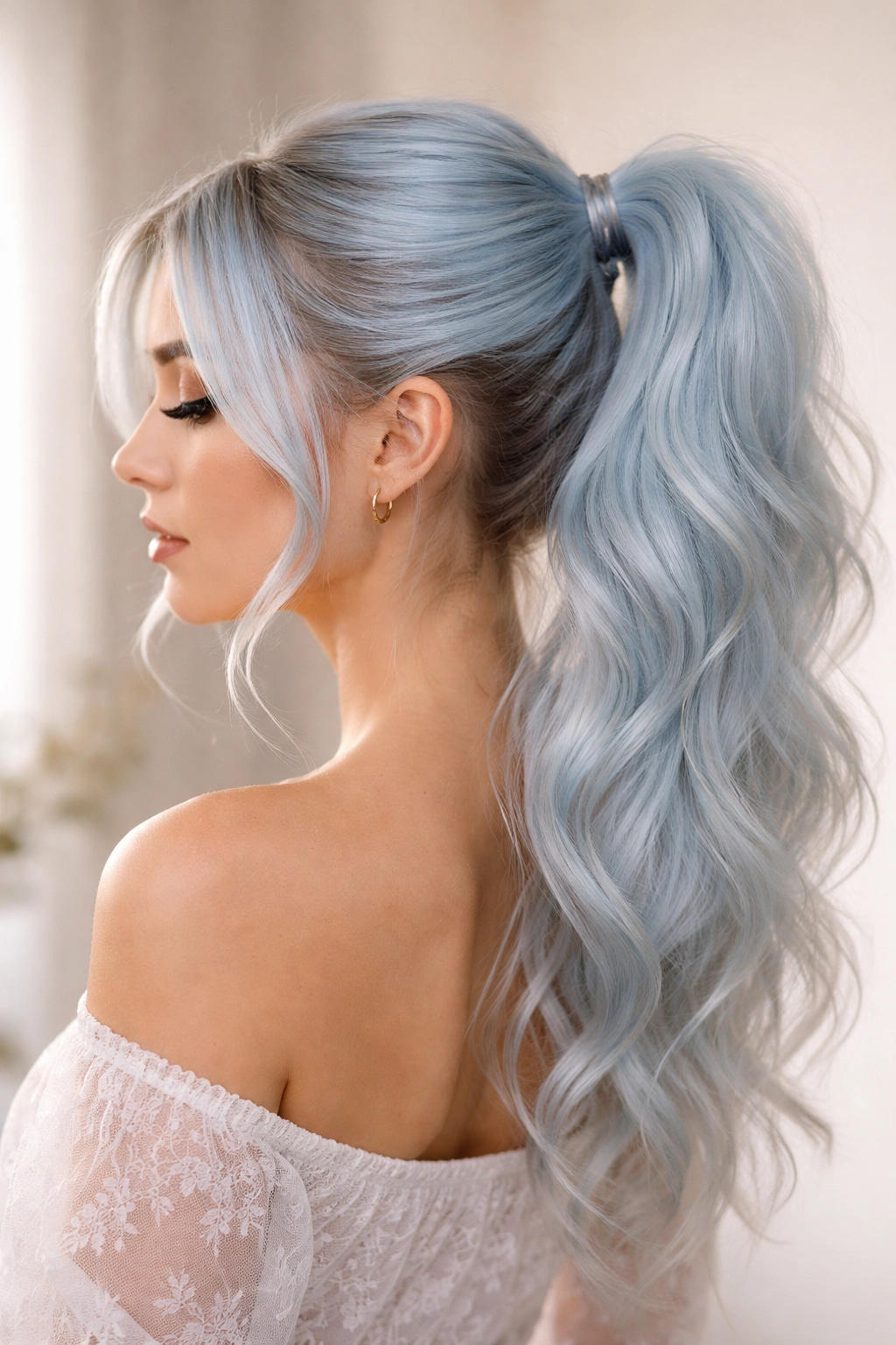 Pastel blue ponytail with soft texture and pale hue against a neutral background