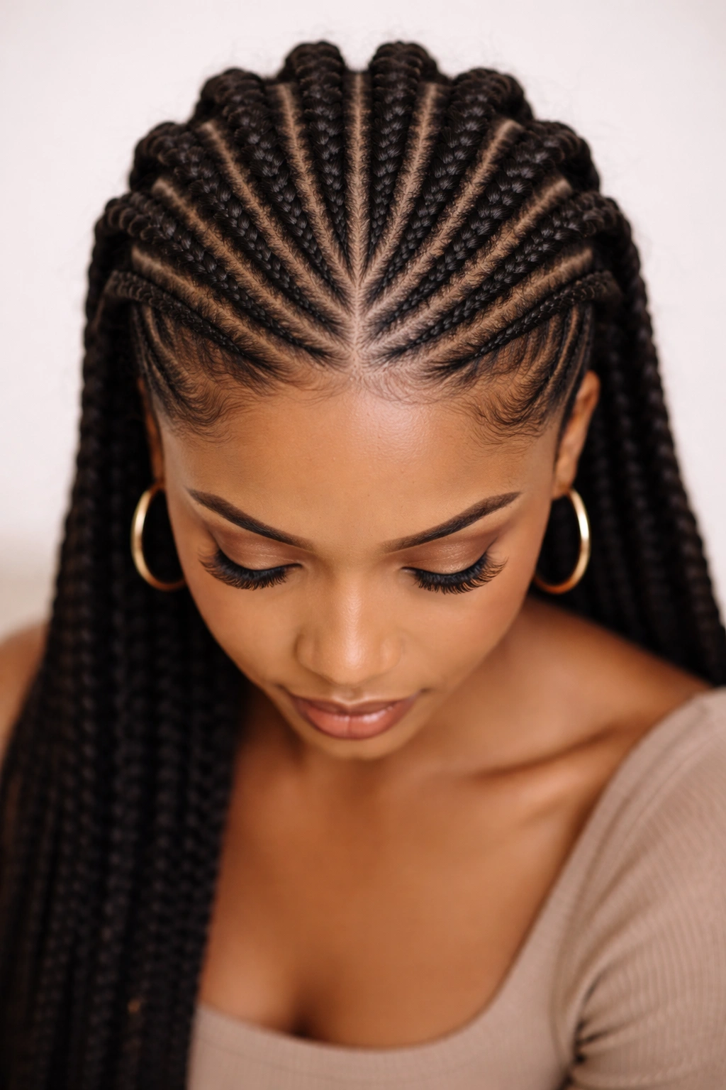 Top-down view of raised reverse cornrows around the crown