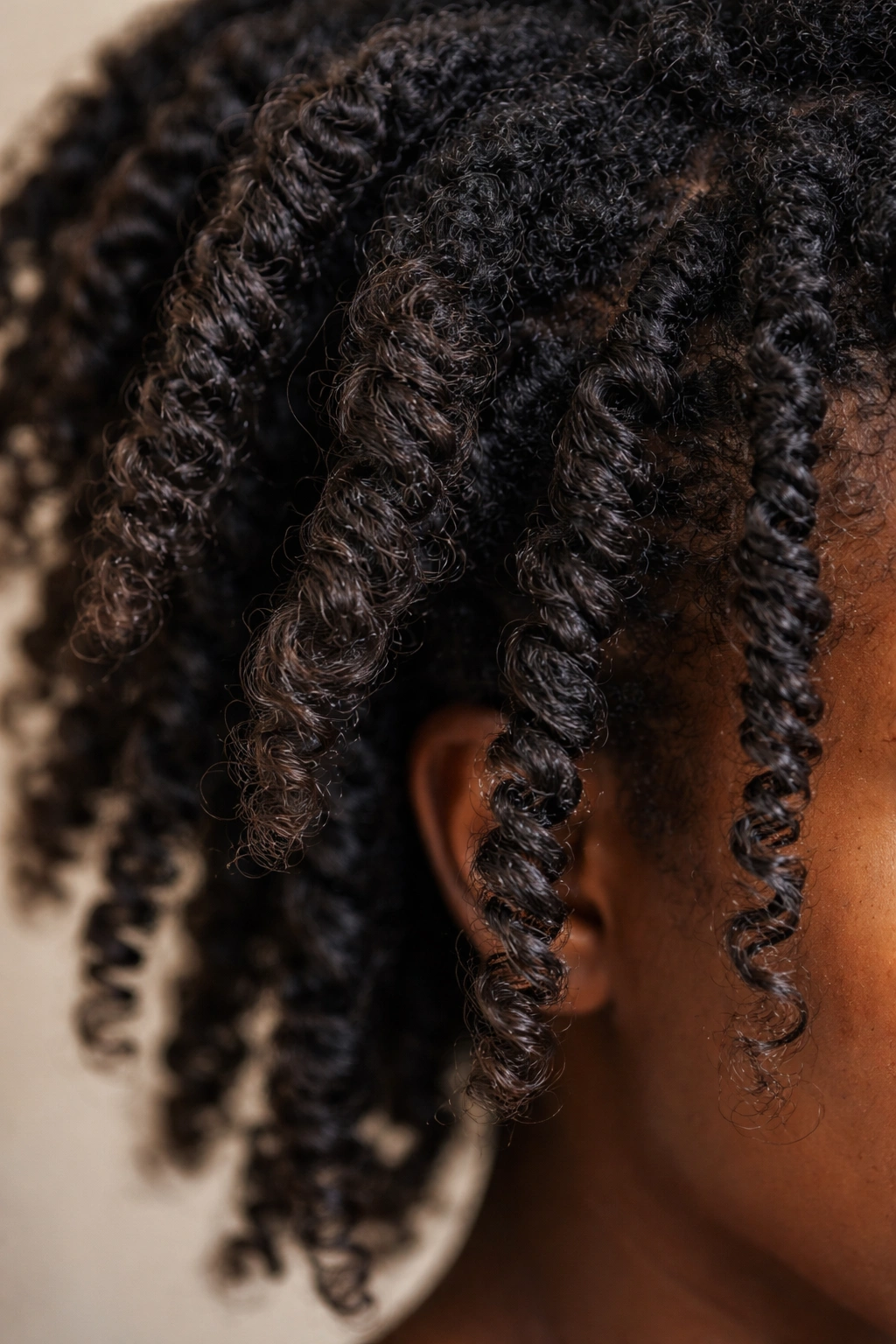 Uneven twists with frizz on Type 4 hair