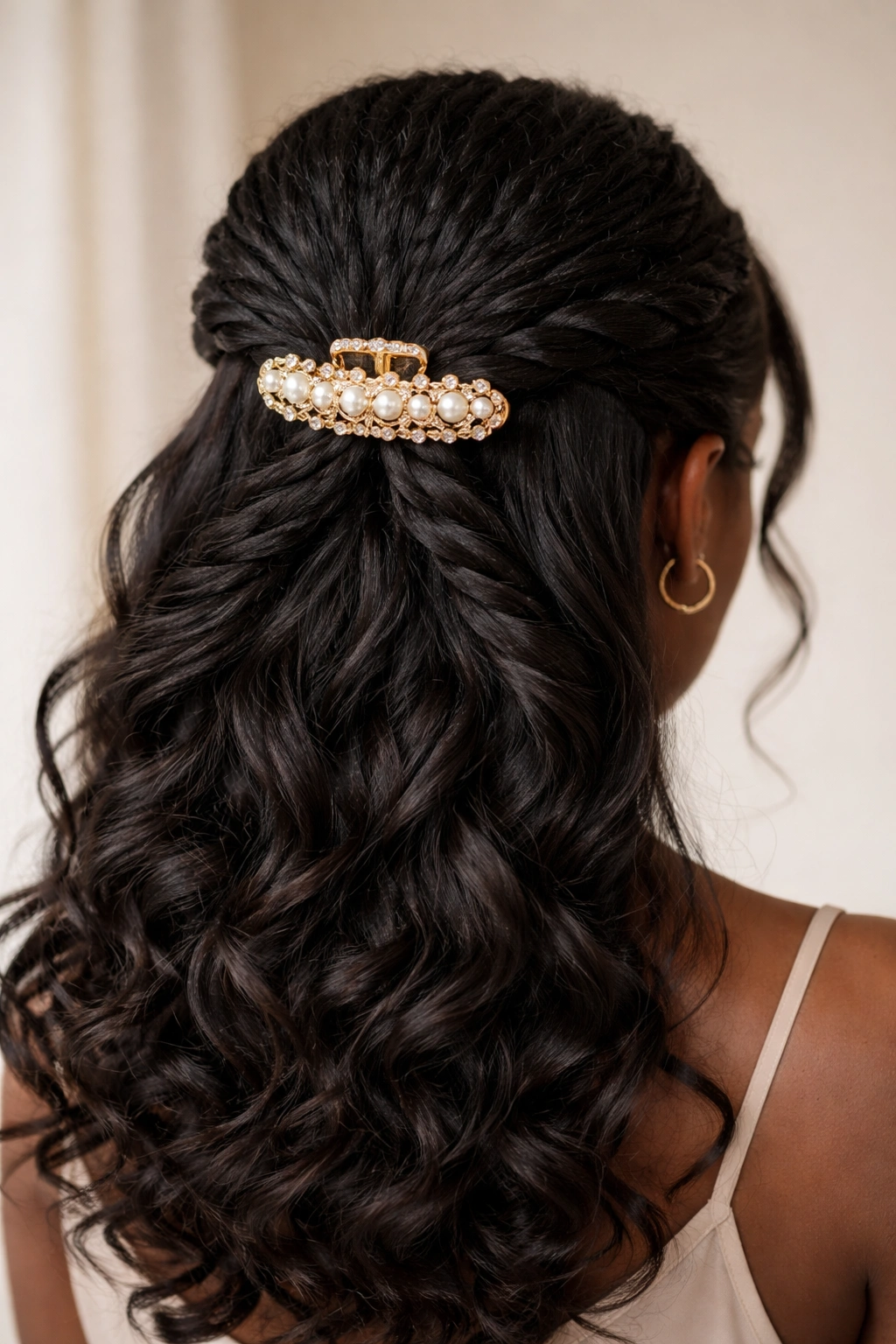 Two rope twists crossing at the back secured with a large claw clip