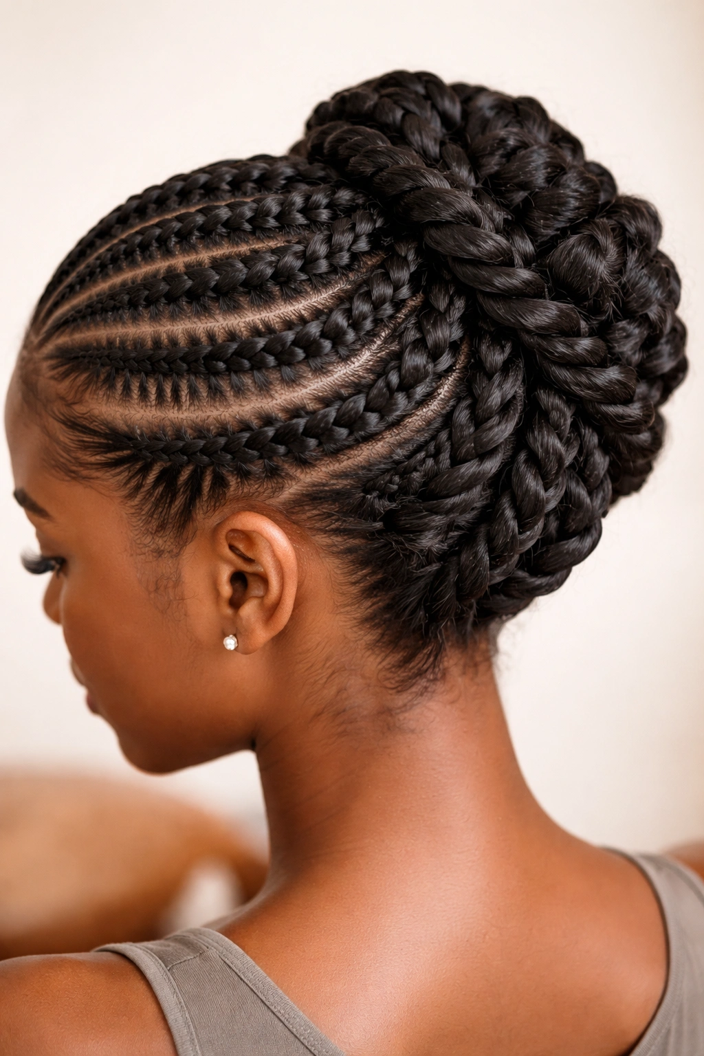 Crown of stitch cornrows with twists forming an updo