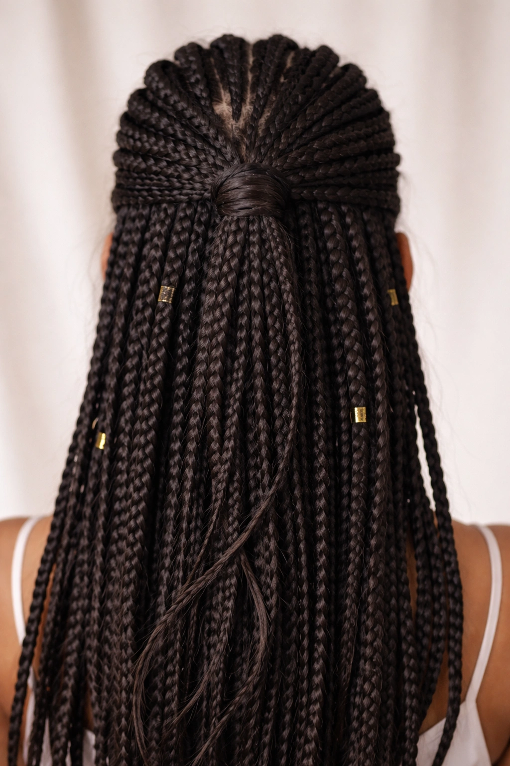 Knotless half-up braid with wrapped base concealing elastic