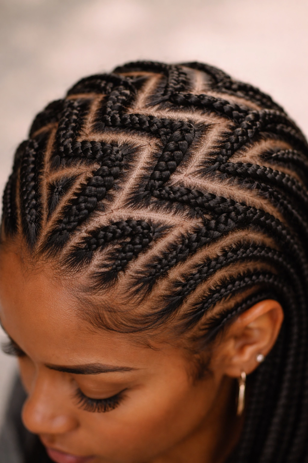 Close-up of zigzag cornrows across the scalp