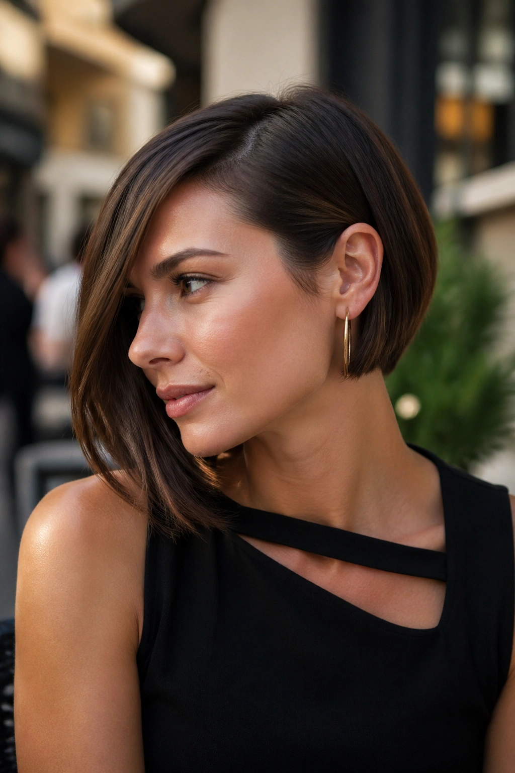 Portrait of a woman with asymmetrical bob and ear tuck