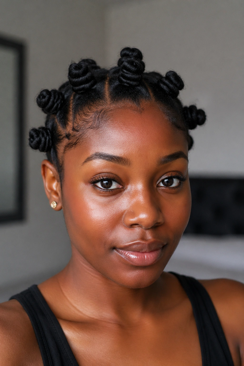 Close-up of real person with bantu knots on short hair