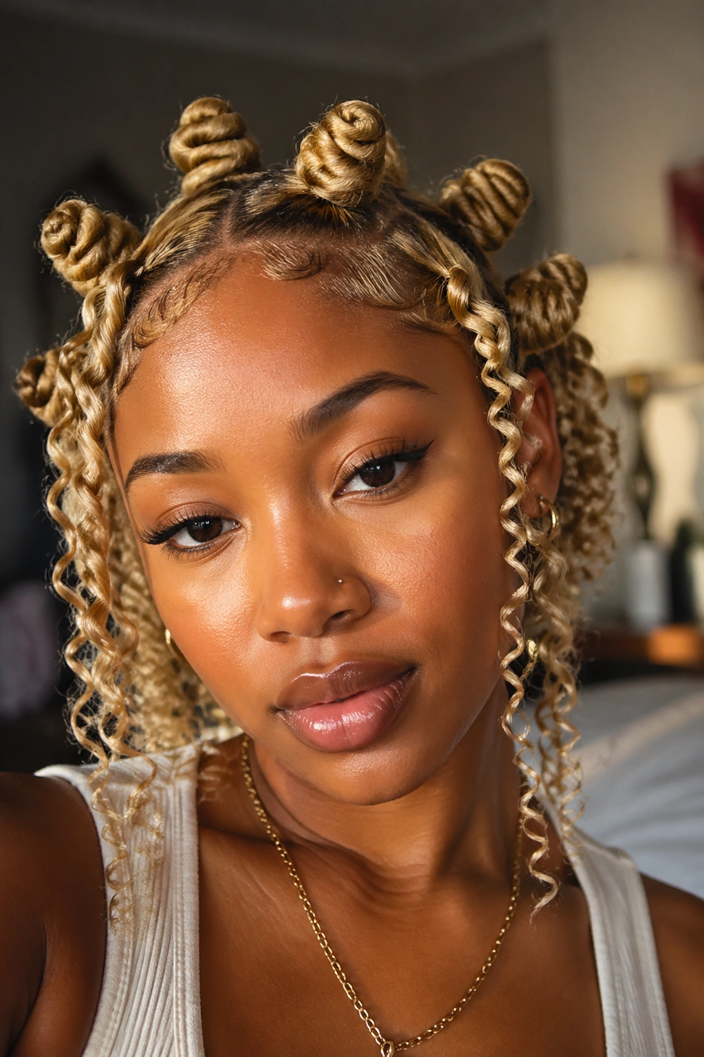 Real person with knots and curly ends in blonde hair