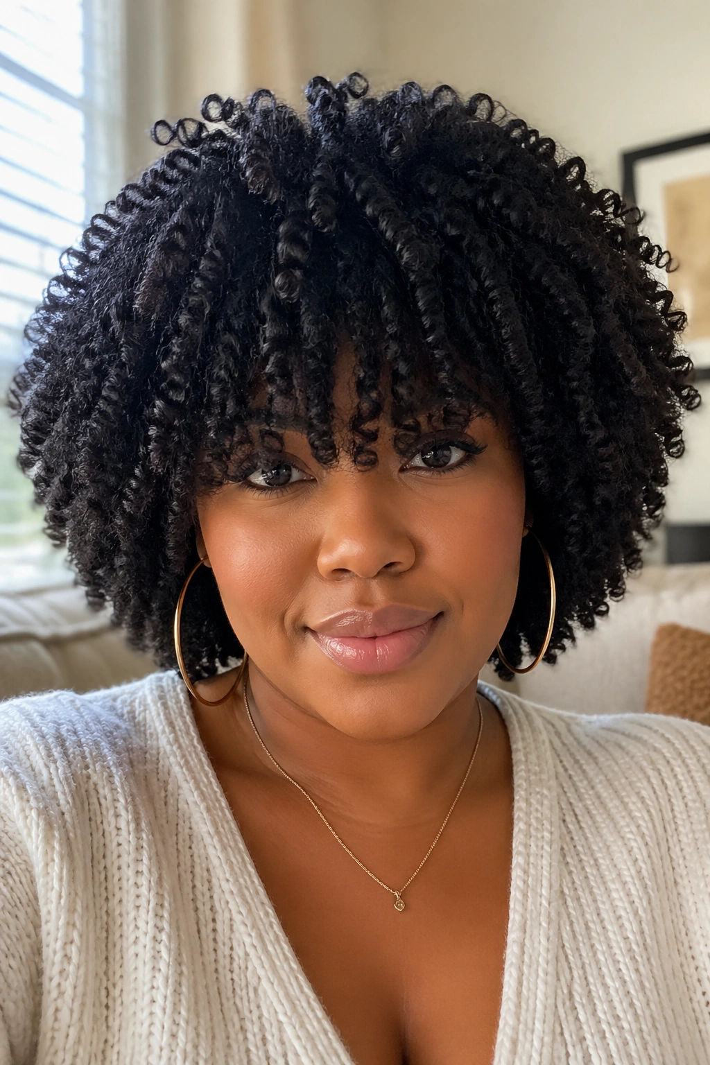 Close-up of real person with bangs in crochet afro