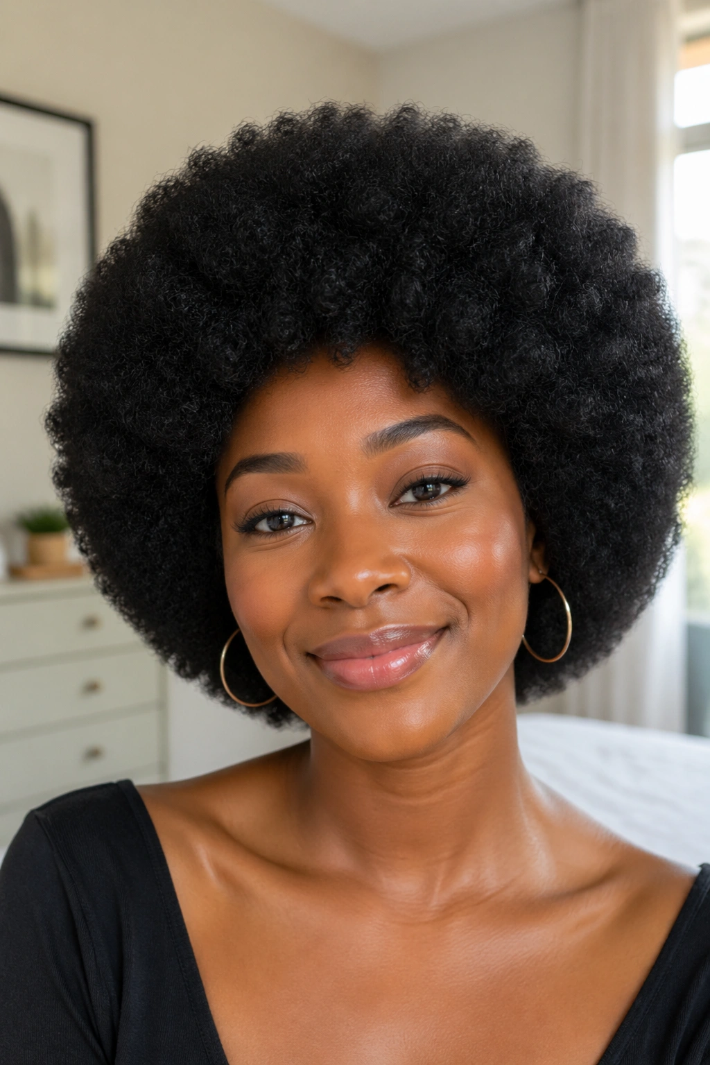 Close-up of a real woman wearing a Rounded Full Afro Wig With Soft, Even Volume
