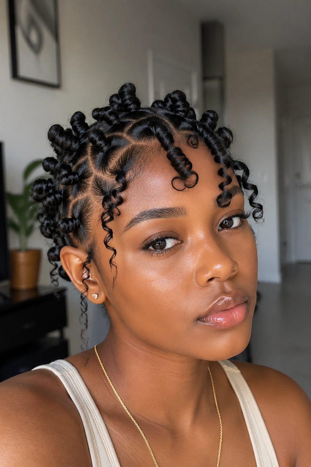 Close-up of a real woman with short hair in Bantu knots and finger coils