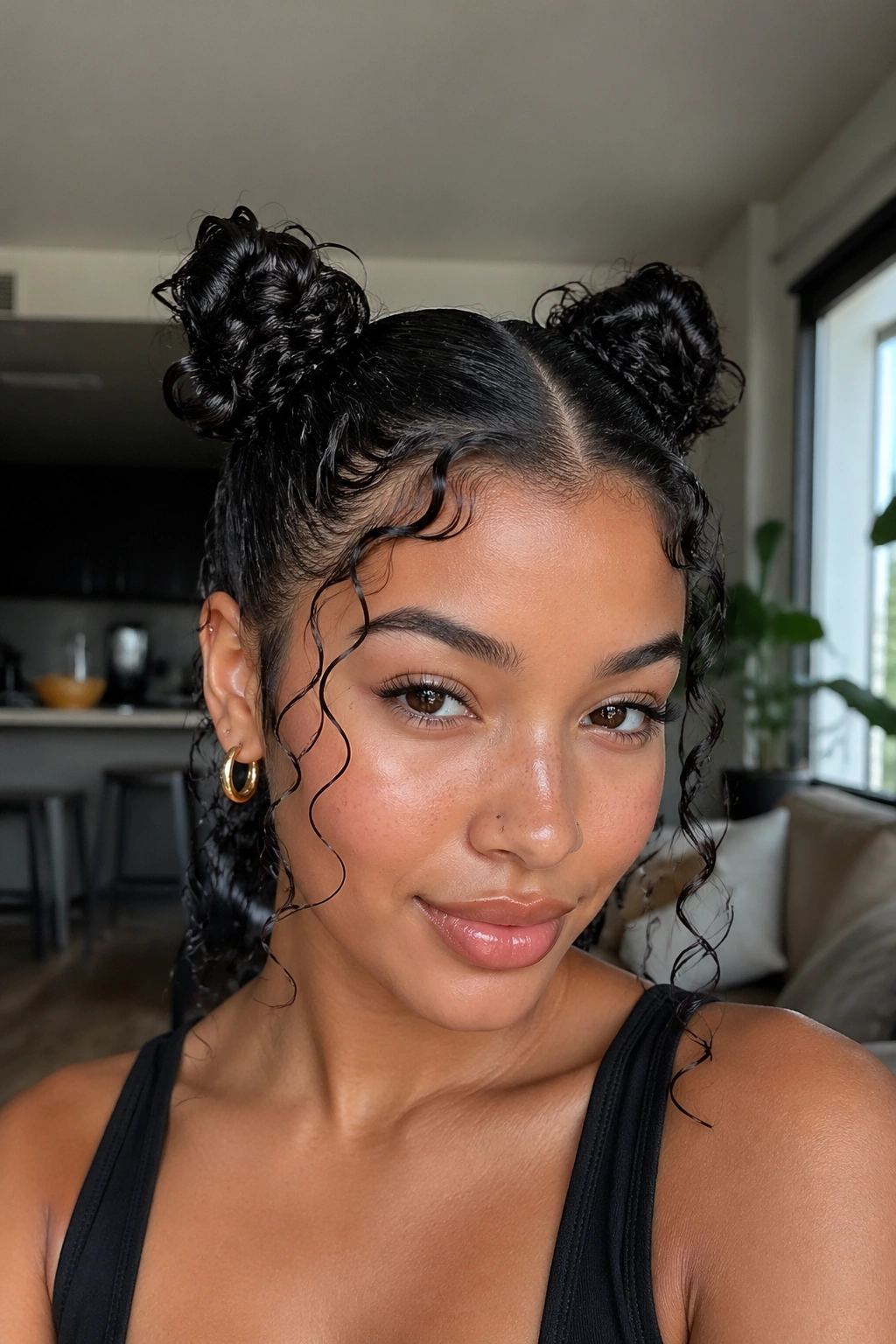 Close-up of a real woman with wet curly space buns