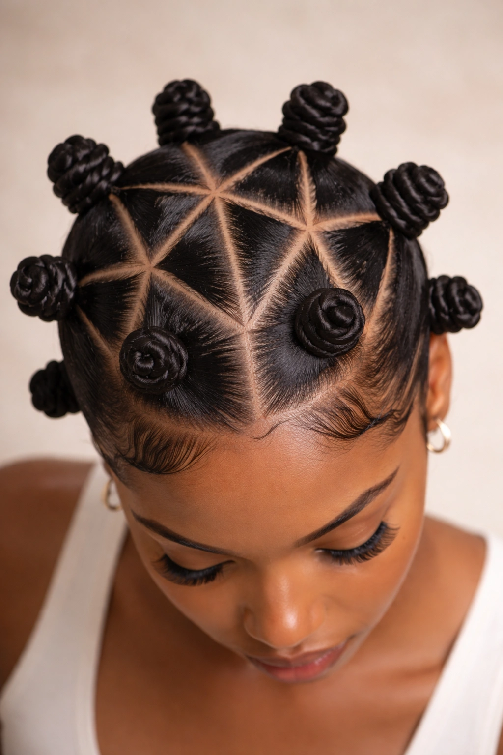 Close-up of triangle-part knots showing crisp scalp triangles and neat sections