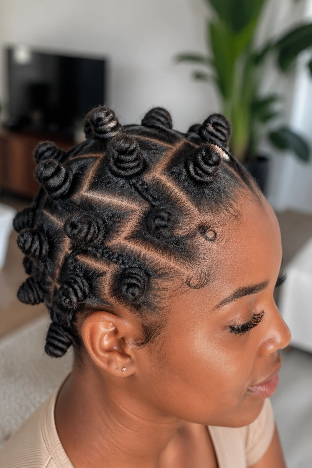 Close-up of a real person with zigzag part and bantu knots on short natural hair