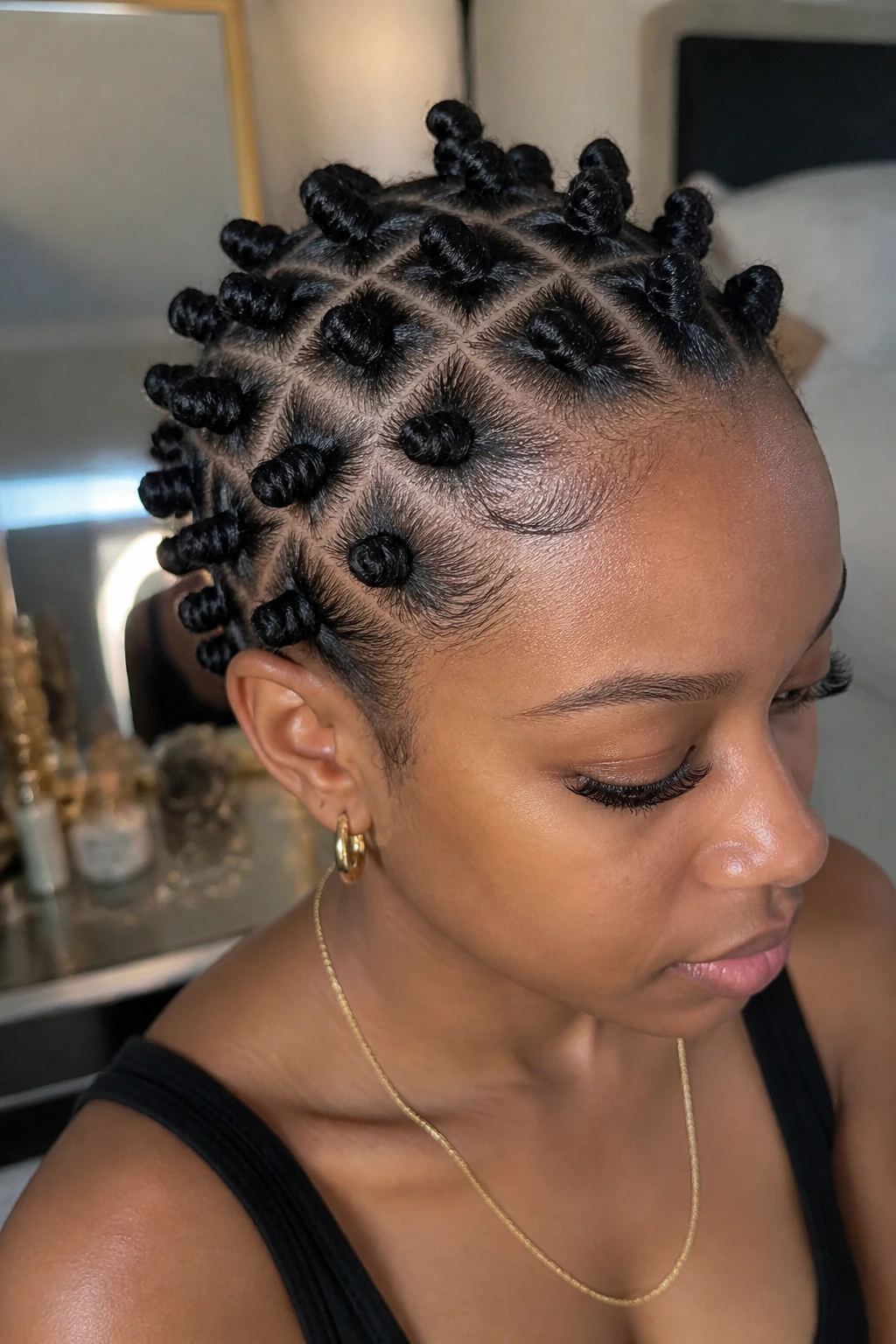 Close-up of a real woman with mini Bantu knots on stretched relaxed hair