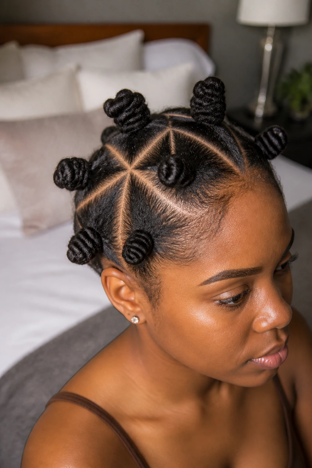 Close-up of head showing triangle-part Bantu knots across the scalp