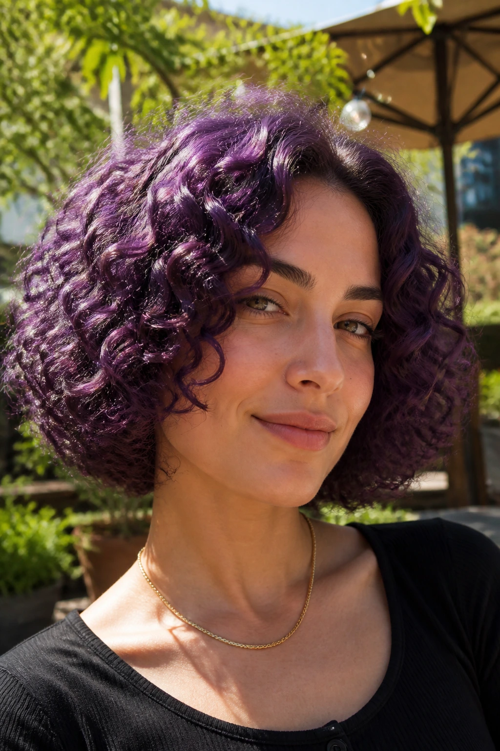 Close-up of a real person with violet curly bob and rounded shape